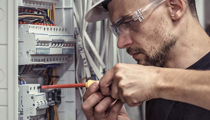 Electrician checking the wires