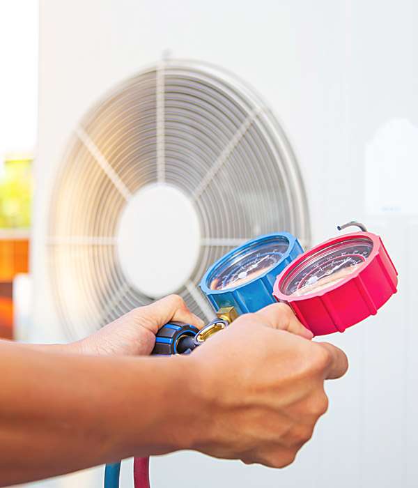 technician using HVAC equipment