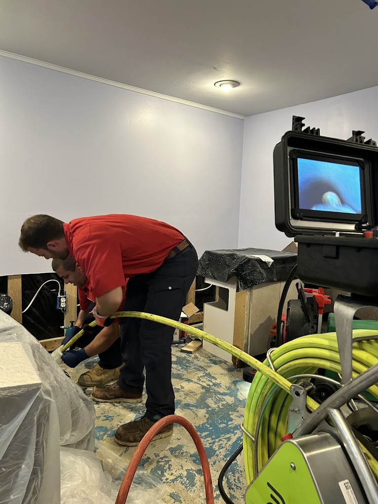 man conducting camera drain inspection in drains and pipes