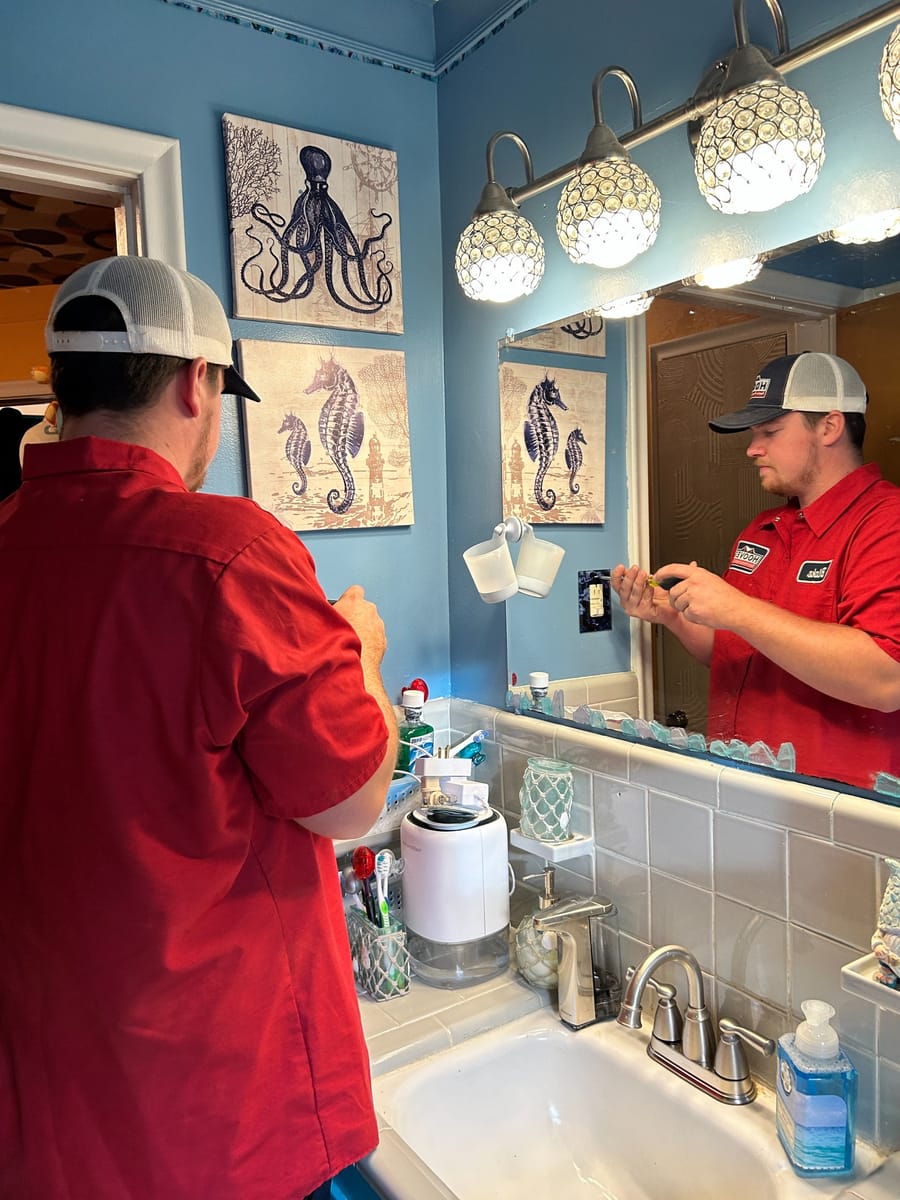 Electrician working on GFCI outlet