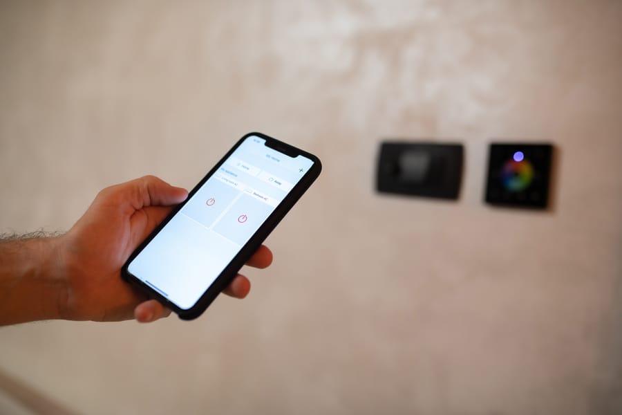 holding a phone up to control smart home appliances
