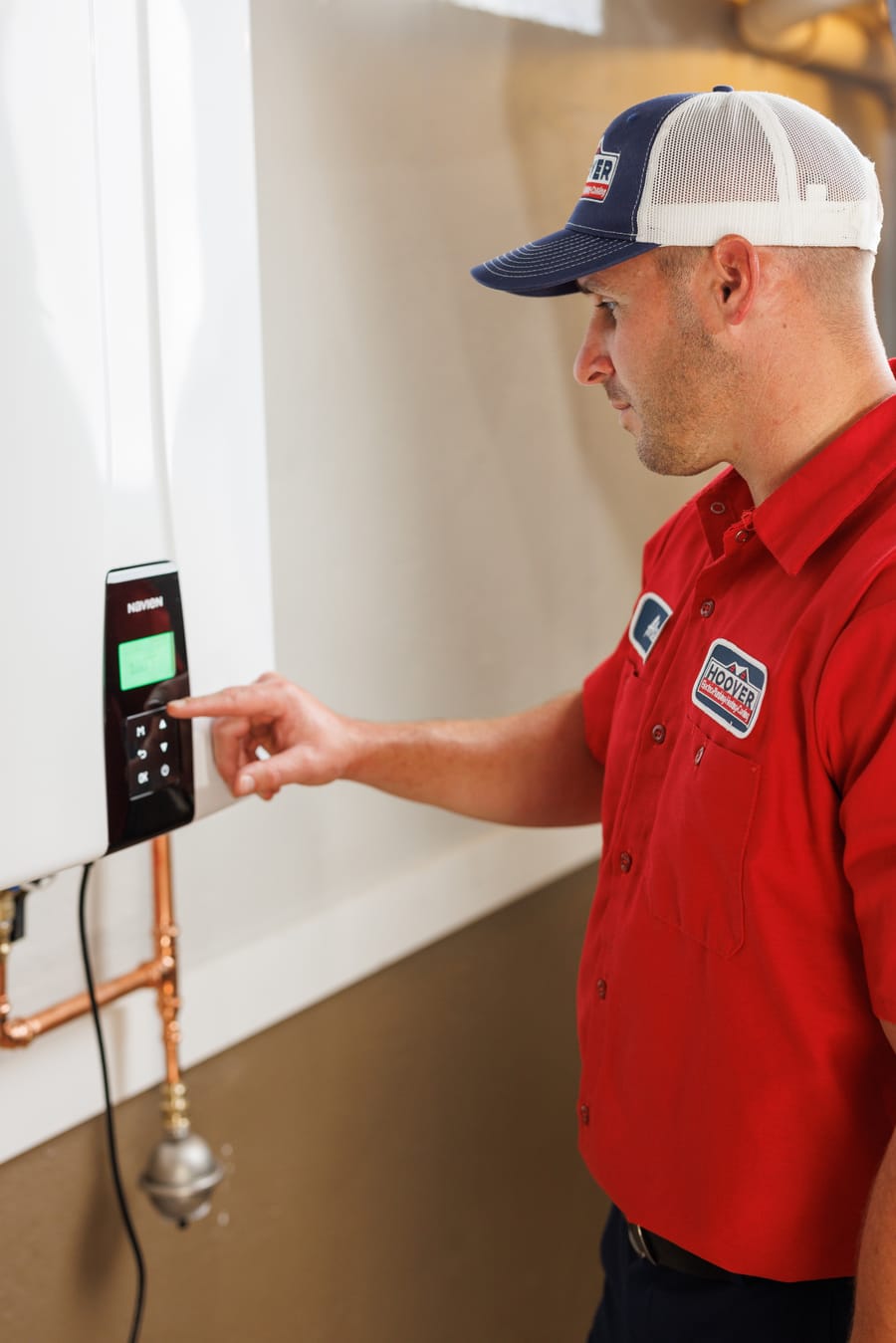 technician adjusting the water heater system