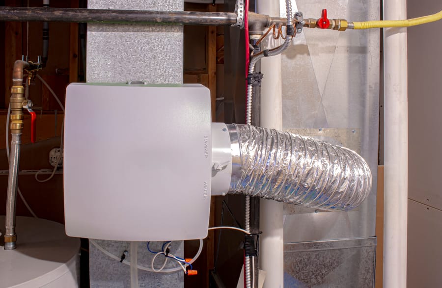 A home humidifier attached to the return duct with a bypass connection.